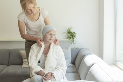 adult woman taking care of senior woman