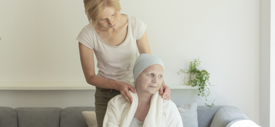 adult woman taking care of senior woman